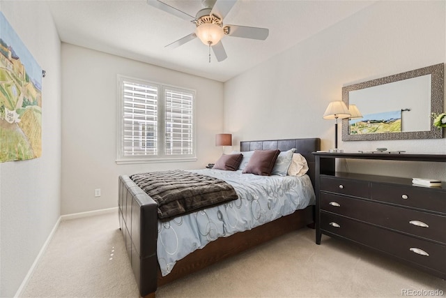 bedroom featuring light carpet and ceiling fan