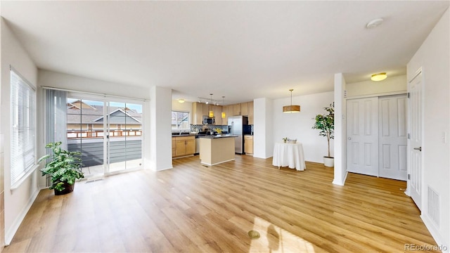 unfurnished living room with light hardwood / wood-style flooring