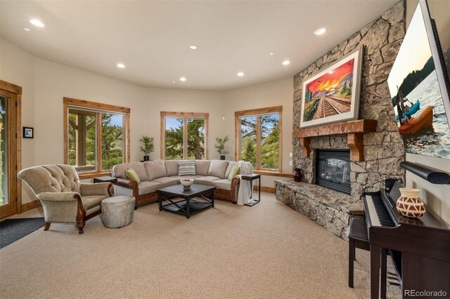 309 Eastridge Dr, Dillon, CO 80435 - living area with carpet, recessed lighting, plenty of natural light, and a stone fireplace