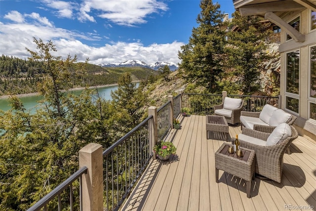 309 Eastridge Dr, Dillon, CO 80435 - wooden deck with a water and mountain view and an outdoor living space