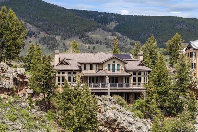309 Eastridge Dr, Dillon, CO 80435 - mountain view featuring a forest