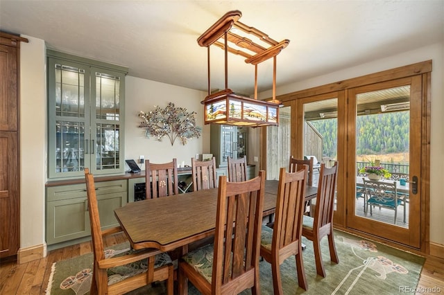 309 Eastridge Dr, Dillon, CO 80435 - dining area with light wood finished floors and baseboards