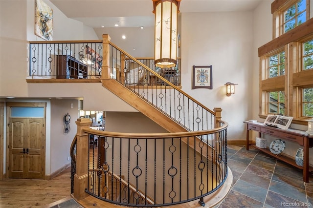309 Eastridge Dr, Dillon, CO 80435 - stairs with a high ceiling and recessed lighting