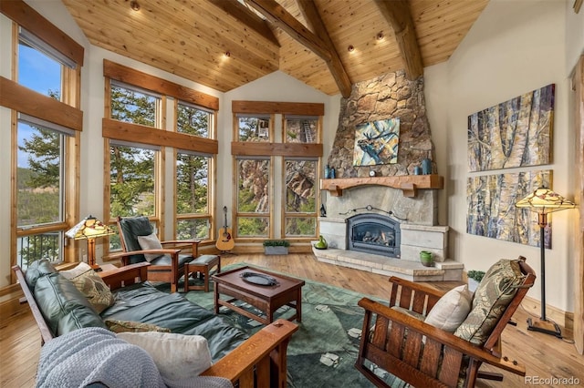 309 Eastridge Dr, Dillon, CO 80435 - living room with hardwood / wood-style floors, a wooden ceiling with exposed beams, high vaulted ceiling, plenty of natural light, and a fireplace