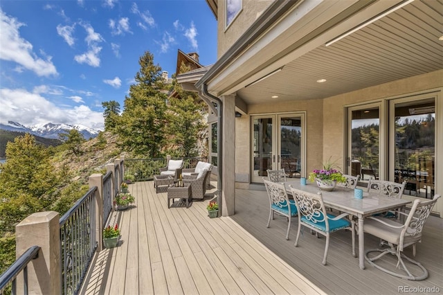 309 Eastridge Dr, Dillon, CO 80435 - deck with outdoor lounge area, a mountain view, and outdoor dining space