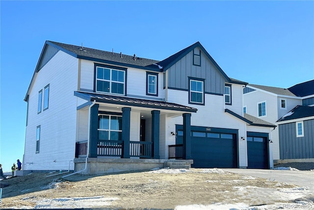 view of front of property featuring covered porch and a garage