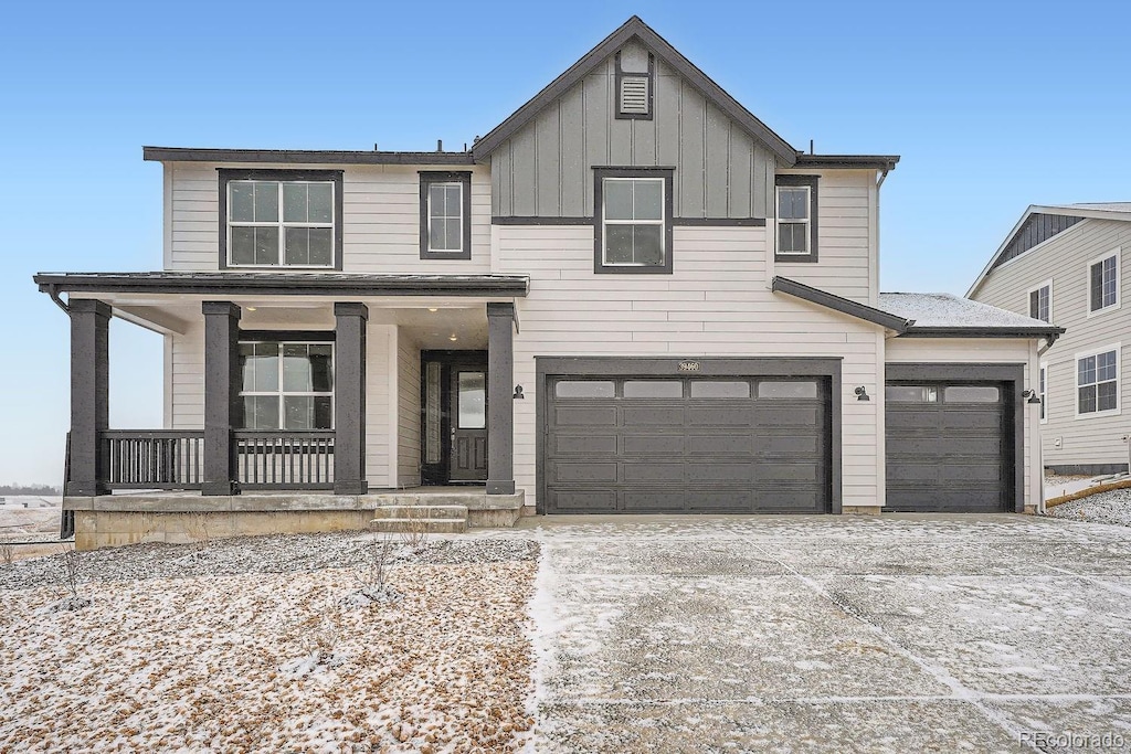 view of front of house with a garage and a porch