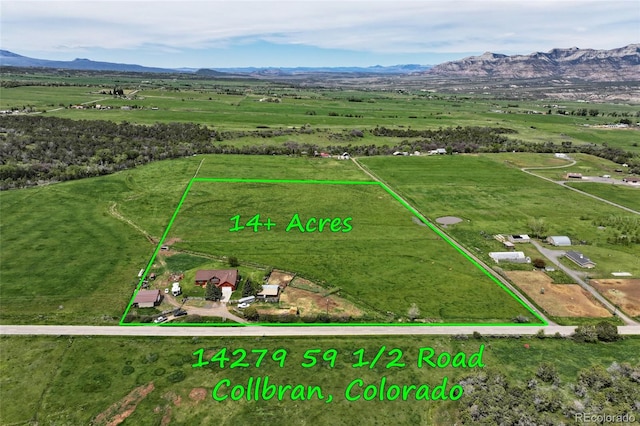 aerial view featuring a mountain view and a rural view