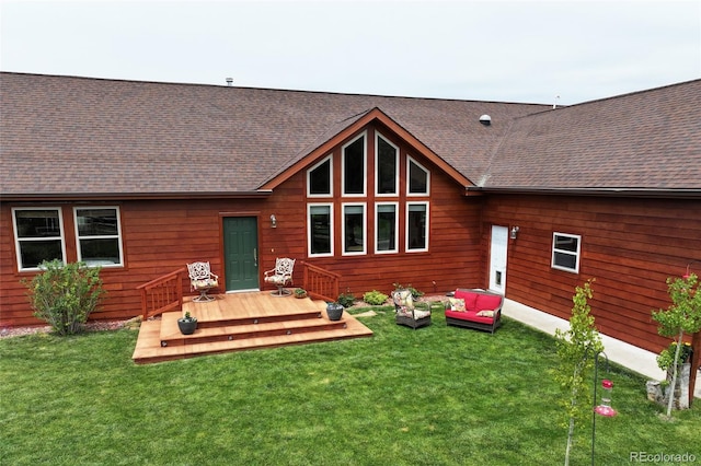 rear view of house featuring a deck, an outdoor hangout area, and a yard