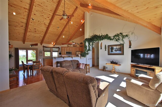 carpeted living room with high vaulted ceiling, ceiling fan, beam ceiling, and wood ceiling