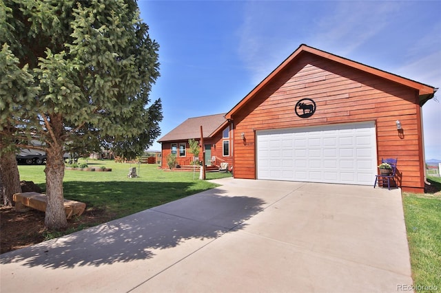 view of front of house with a garage and a front lawn