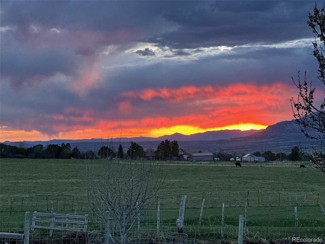 mountain view featuring a rural view