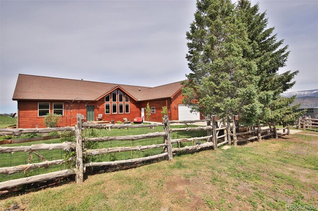 log-style house with a front yard