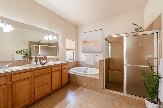 bathroom featuring vanity, shower with separate bathtub, and tile patterned floors