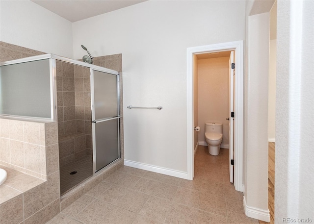 bathroom featuring separate shower and tub, toilet, and tile patterned floors