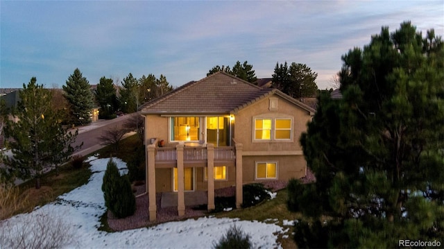 view of front of property with a balcony