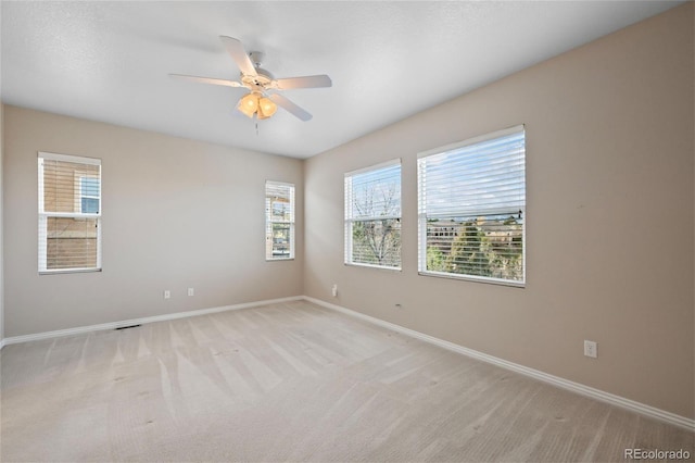 carpeted empty room with ceiling fan