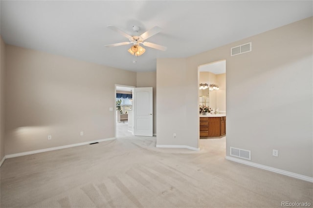 carpeted empty room with ceiling fan