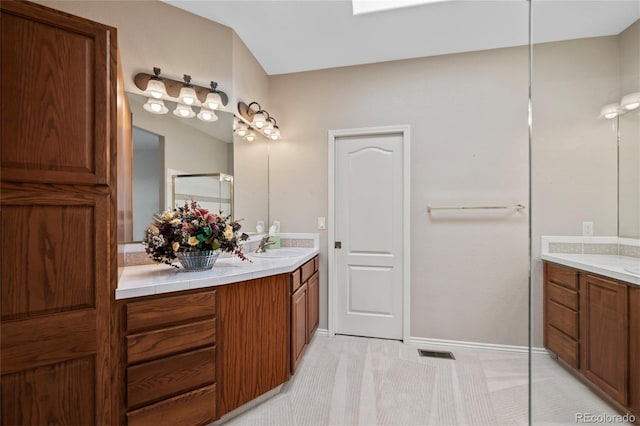 bathroom featuring vanity and walk in shower