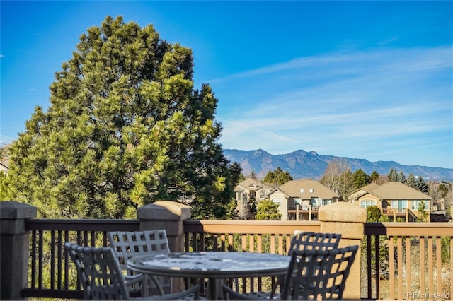 wooden terrace featuring a mountain view