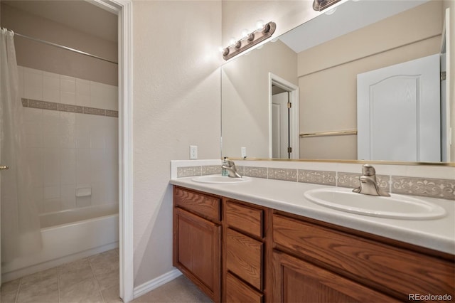 bathroom with tile patterned floors, vanity, and shower / bath combo