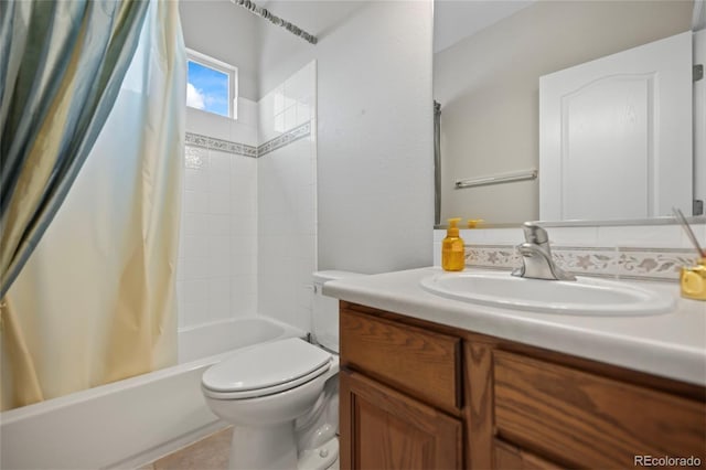 full bathroom featuring shower / bath combo, vanity, toilet, and tile patterned floors