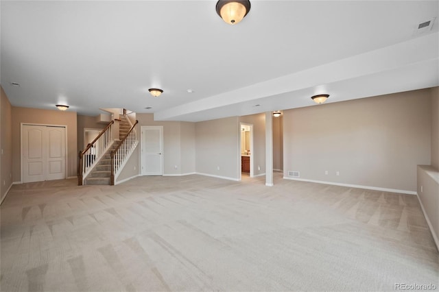 interior space featuring light colored carpet