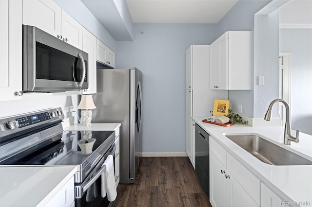 7422 S Quail Cir Unit 1624, Littleton, CO 80127 - kitchen featuring stainless steel appliances, a sink, dark wood finished floors, white cabinets, and light countertops