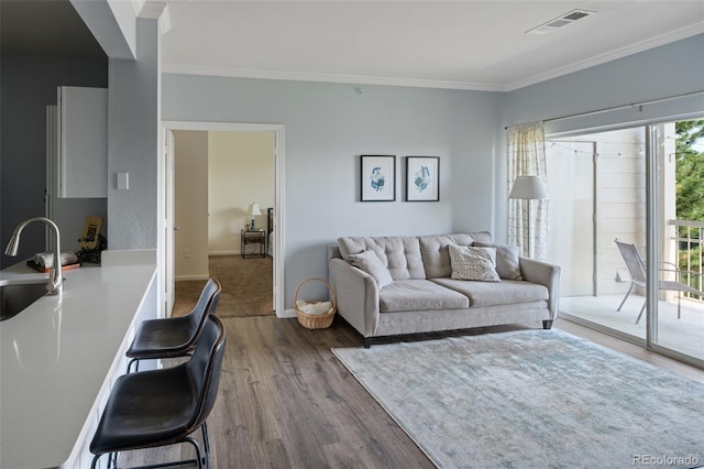 7422 S Quail Cir Unit 1624, Littleton, CO 80127 - living area featuring crown molding, dark wood-type flooring, and baseboards