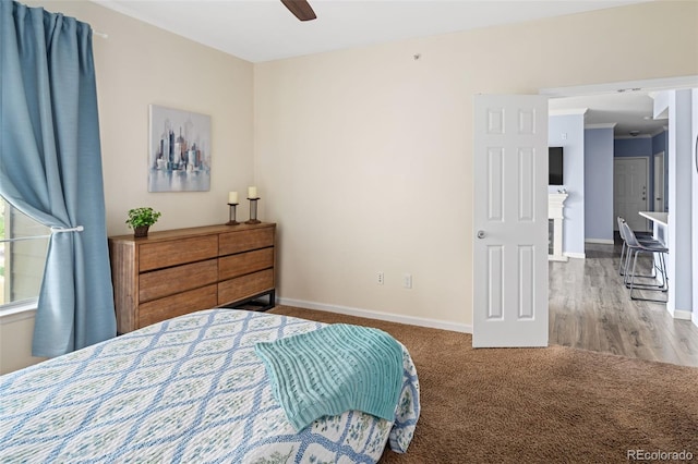 7422 S Quail Cir Unit 1624, Littleton, CO 80127 - carpeted bedroom with baseboards and ceiling fan