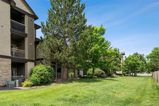 7422 S Quail Cir Unit 1624, Littleton, CO 80127 - view of grassy yard featuring central AC