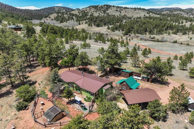 birds eye view of property featuring a mountain view