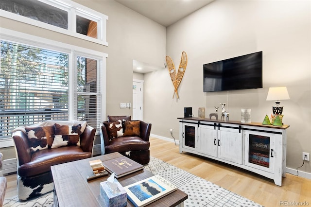 200 Primrose Path Unit 11, Breckenridge, CO 80424 - living area with light wood finished floors, baseboards, and a towering ceiling