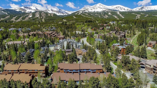 200 Primrose Path Unit 11, Breckenridge, CO 80424 - aerial overview of property's location with a mountain backdrop and nearby suburban area