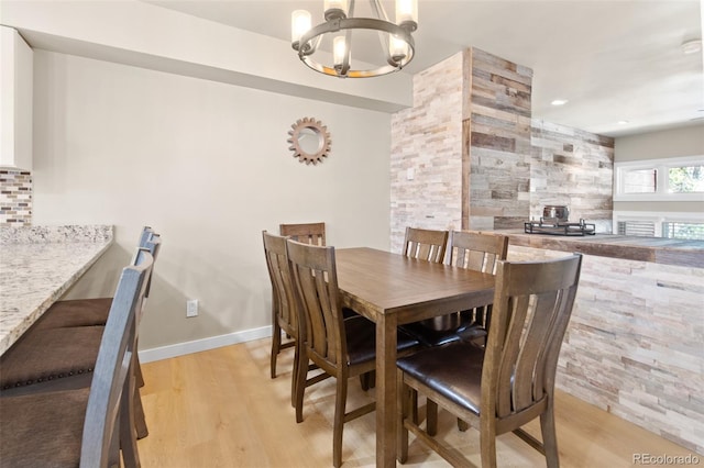 200 Primrose Path Unit 11, Breckenridge, CO 80424 - dining area with a chandelier and light wood-style flooring