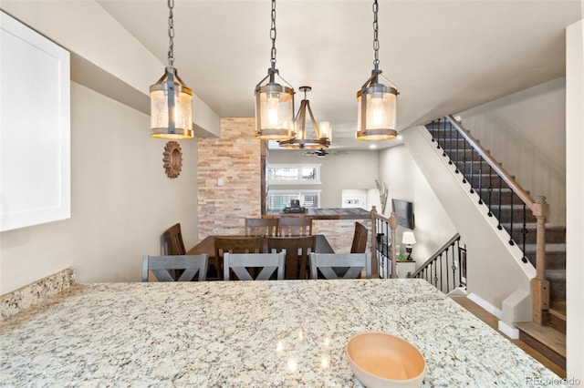 200 Primrose Path Unit 11, Breckenridge, CO 80424 - dining room with stairway, a chandelier, and wood finished floors