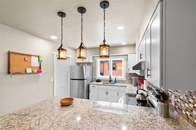 200 Primrose Path Unit 11, Breckenridge, CO 80424 - kitchen with stainless steel appliances, a sink, light stone counters, backsplash, and pendant lighting