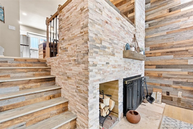 200 Primrose Path Unit 11, Breckenridge, CO 80424 - staircase with an outdoor fireplace, wood walls, and wood finished floors