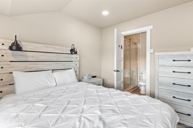 200 Primrose Path Unit 11, Breckenridge, CO 80424 - bedroom with lofted ceiling, ensuite bath, and wood finished floors