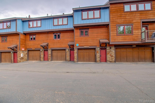200 Primrose Path Unit 11, Breckenridge, CO 80424 - back of house with stone siding and an attached garage