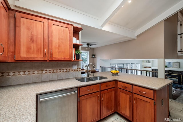 kitchen with dishwasher, sink, backsplash, kitchen peninsula, and ceiling fan