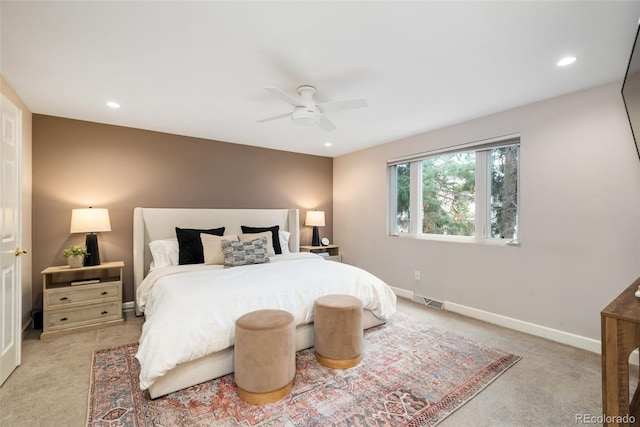 bedroom featuring ceiling fan and light colored carpet