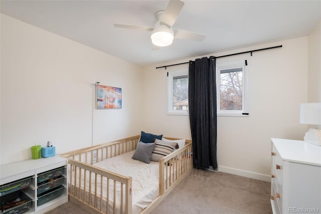 bedroom with ceiling fan and light colored carpet