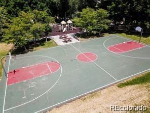 view of sport court with a playground