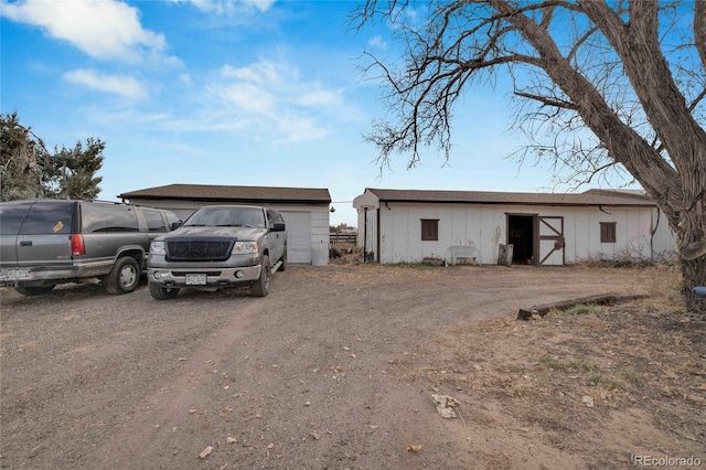 view of front of home featuring an outbuilding