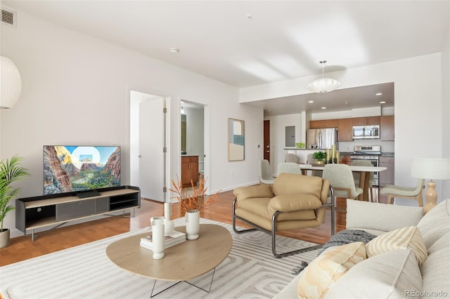 living room with light hardwood / wood-style floors