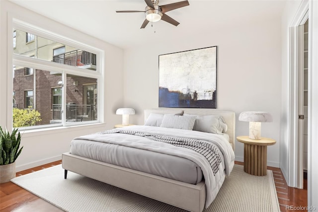 bedroom featuring ceiling fan and hardwood / wood-style flooring