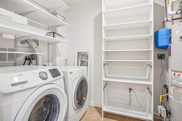 3601 Arapahoe Ave Unit 226, Boulder, CO 80303 - laundry room featuring separate washer and dryer, light tile patterned floors, and water heater