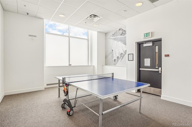 game room with a paneled ceiling and carpet floors