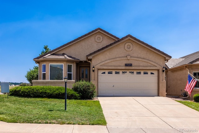 single story home with a garage and a front yard